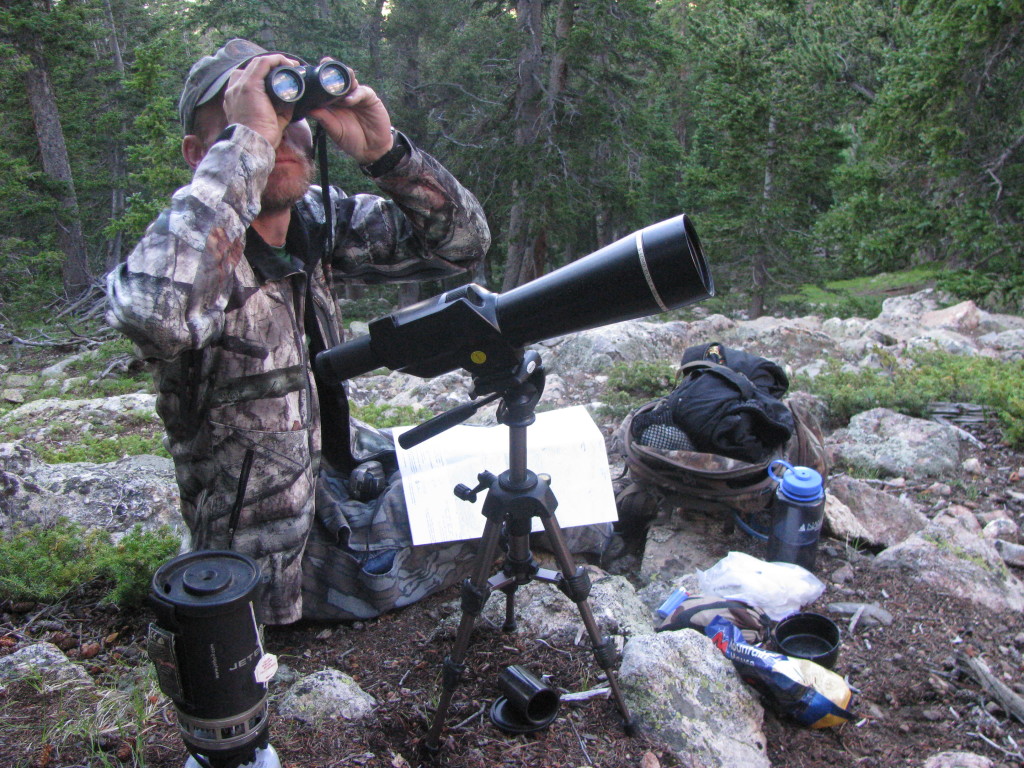 man-looking-for-sheep-through-binoculars