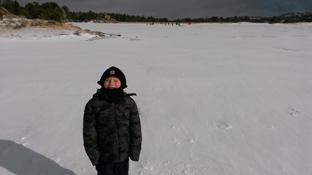 boy-standing-on-frozen-lake